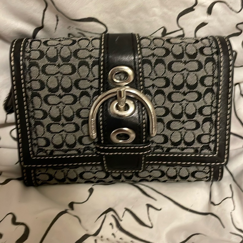 Classy Coach wallet. Coin zipper inside and pocket on the back